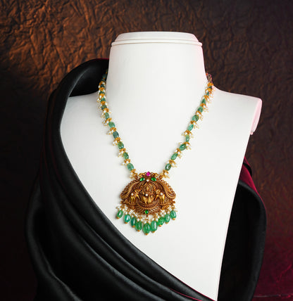 Resonant Gold Laxmi Devi Emerald Stone Necklace