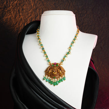 Resonant Gold Laxmi Devi Emerald Stone Necklace