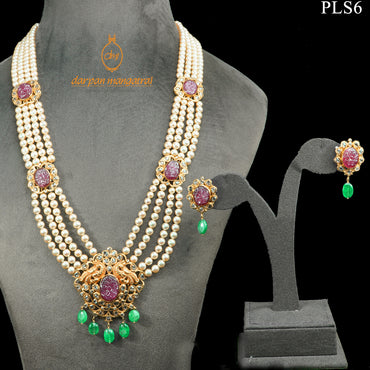 Skilfully Carved Ruby, Polki, Emerald and Pearl Gold Necklace and Earring Set