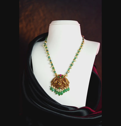 Resonant Gold Laxmi Devi Emerald Stone Necklace