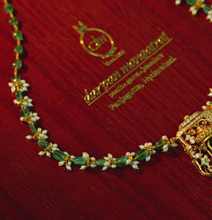 Gleaming Laxmi Devi Gold Emerald Stone Necklace
